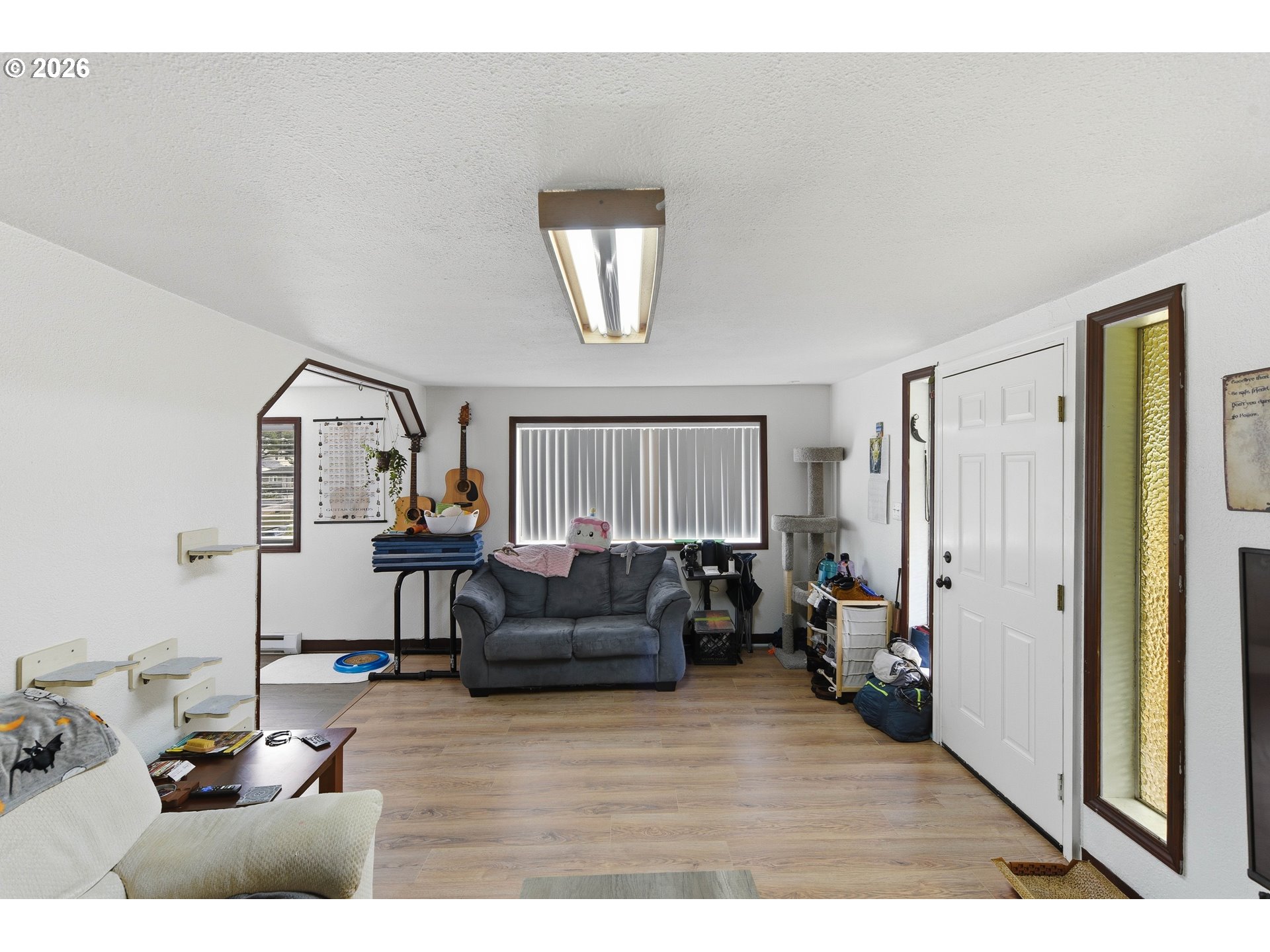 1955 Maple Street North Bend, OR 97459 - Photo 9 of 48 a living room with furniture and a window