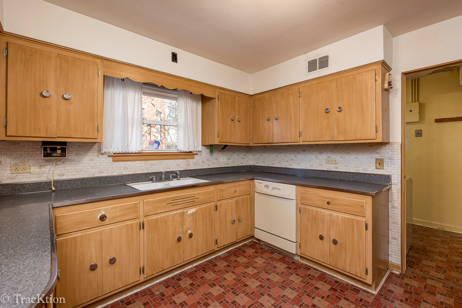 8108 West 30th Street North Riverside, IL 60546 - Photo 22 of 32 a kitchen with white cabinets appliances and a window