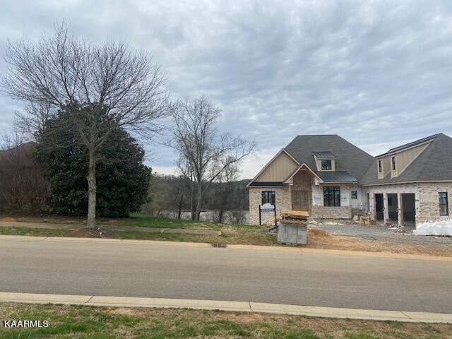 3656 Persimmon Ridge Loudon, TN 37774 - Photo 4 of 17 a front view of a house with a yard