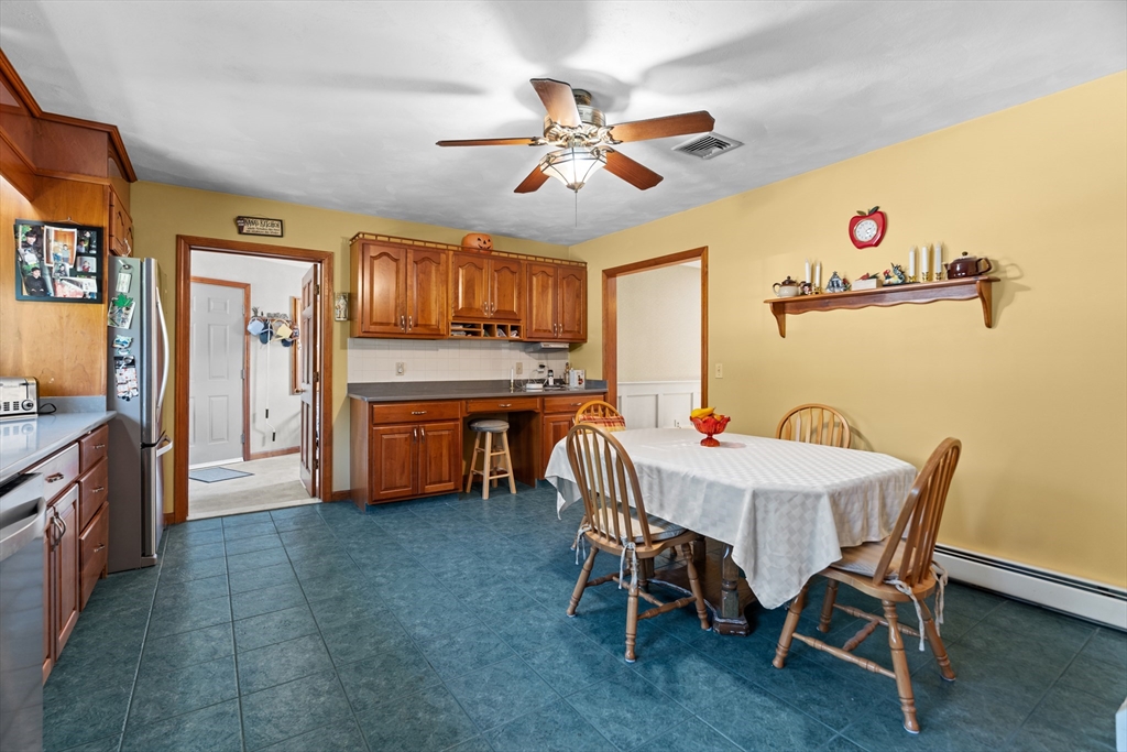 36 High Street Freetown, MA 02702 - Photo 18 of 42 a view of a dining room with furniture and a chandelier