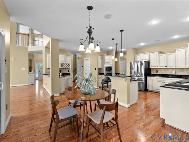 a kitchen with stainless steel appliances a stove a sink a refrigerator and cabinets