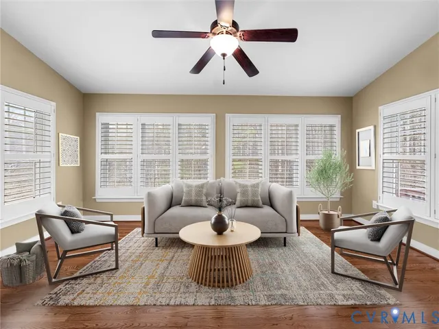 a view of a livingroom with a ceiling fan and a bathroom