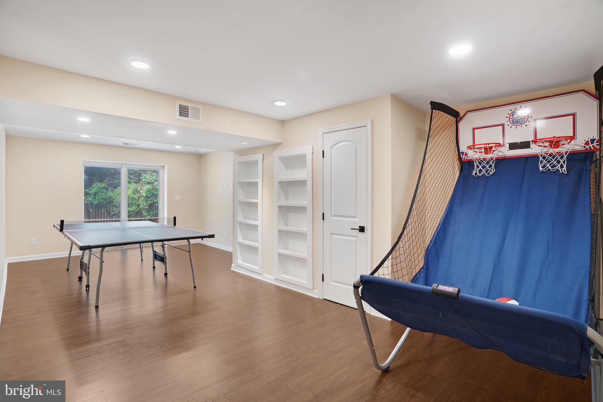 7628 Gralnick Place Springfield, VA 22153 - Photo 40 of 60 Family Room Basement w/ built ins and Walkout