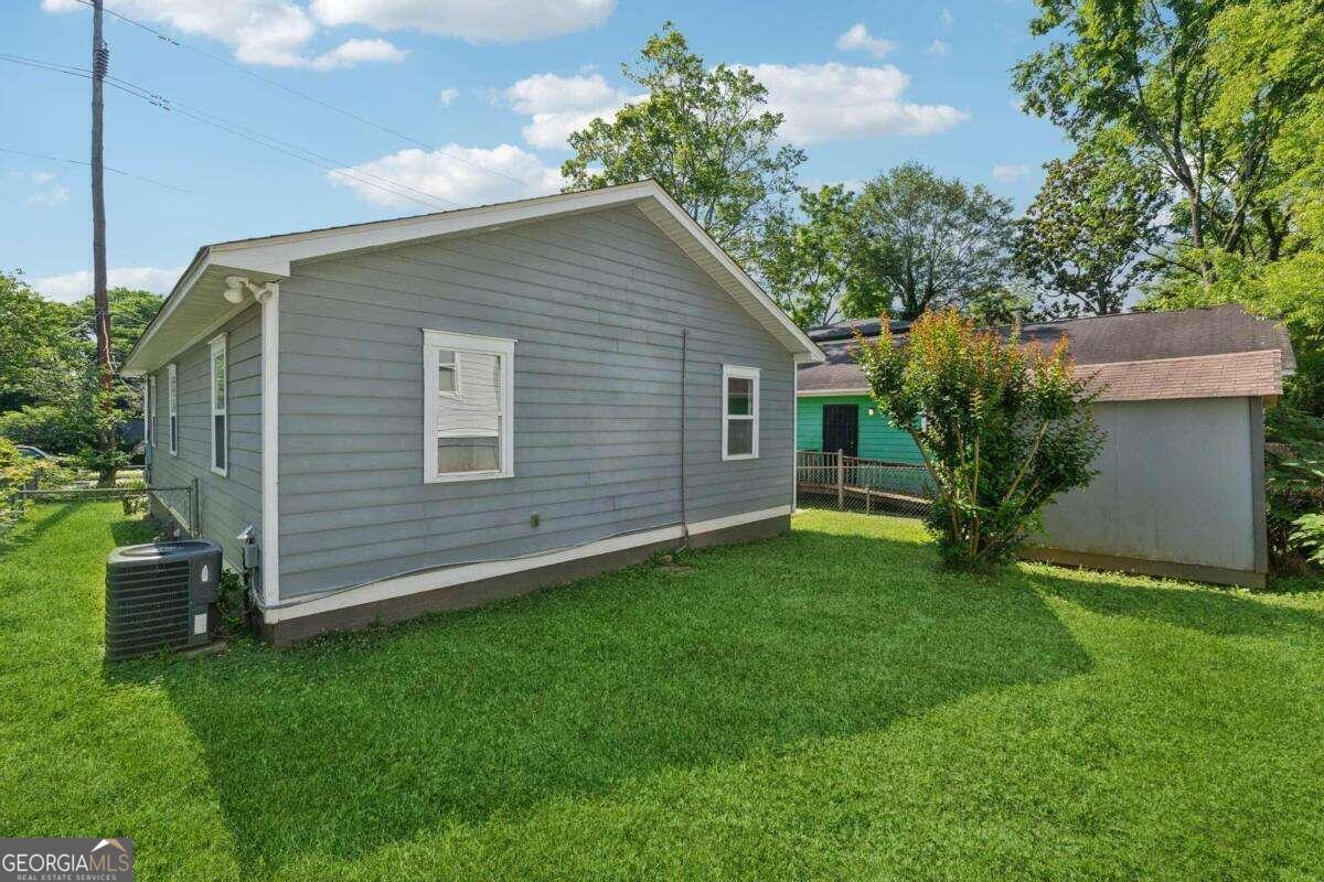 823 Humphries Street Southwest Atlanta, GA 30310 - Photo 21 of 22 a house with a tree in front of it