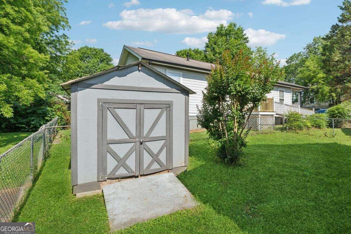 823 Humphries Street Southwest Atlanta, GA 30310 - Photo 22 of 22 a front view of a house with garden