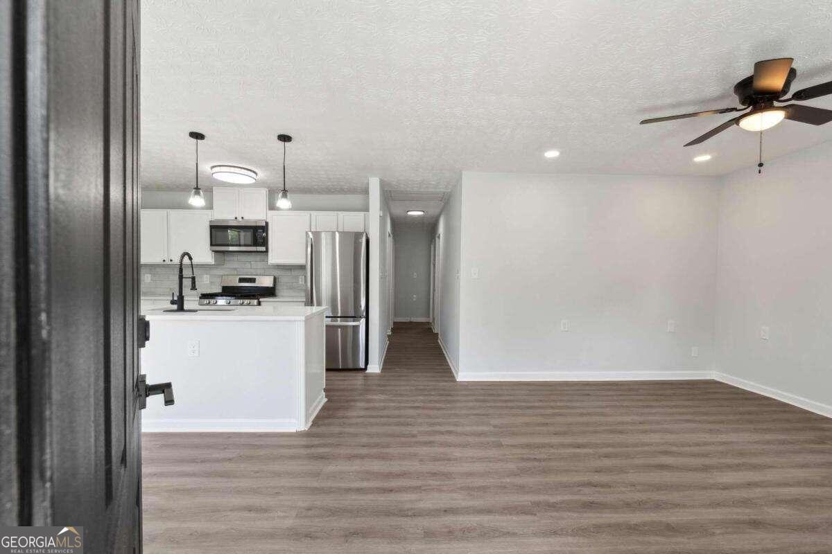 823 Humphries Street Southwest Atlanta, GA 30310 - Photo 5 of 22 a view of kitchen with wooden floor