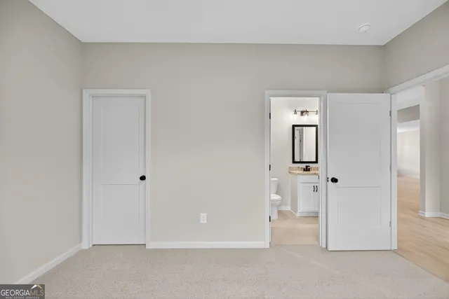 an empty room with closet area