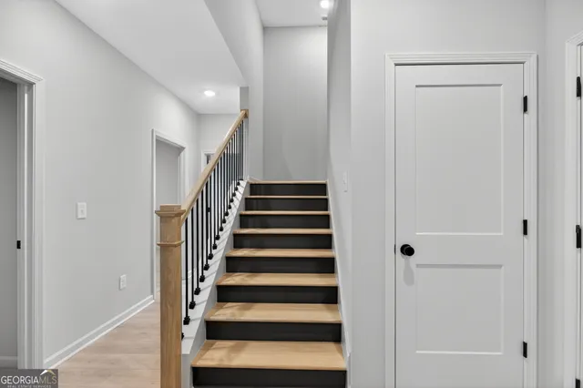 a view of entryway with wooden floor and windows