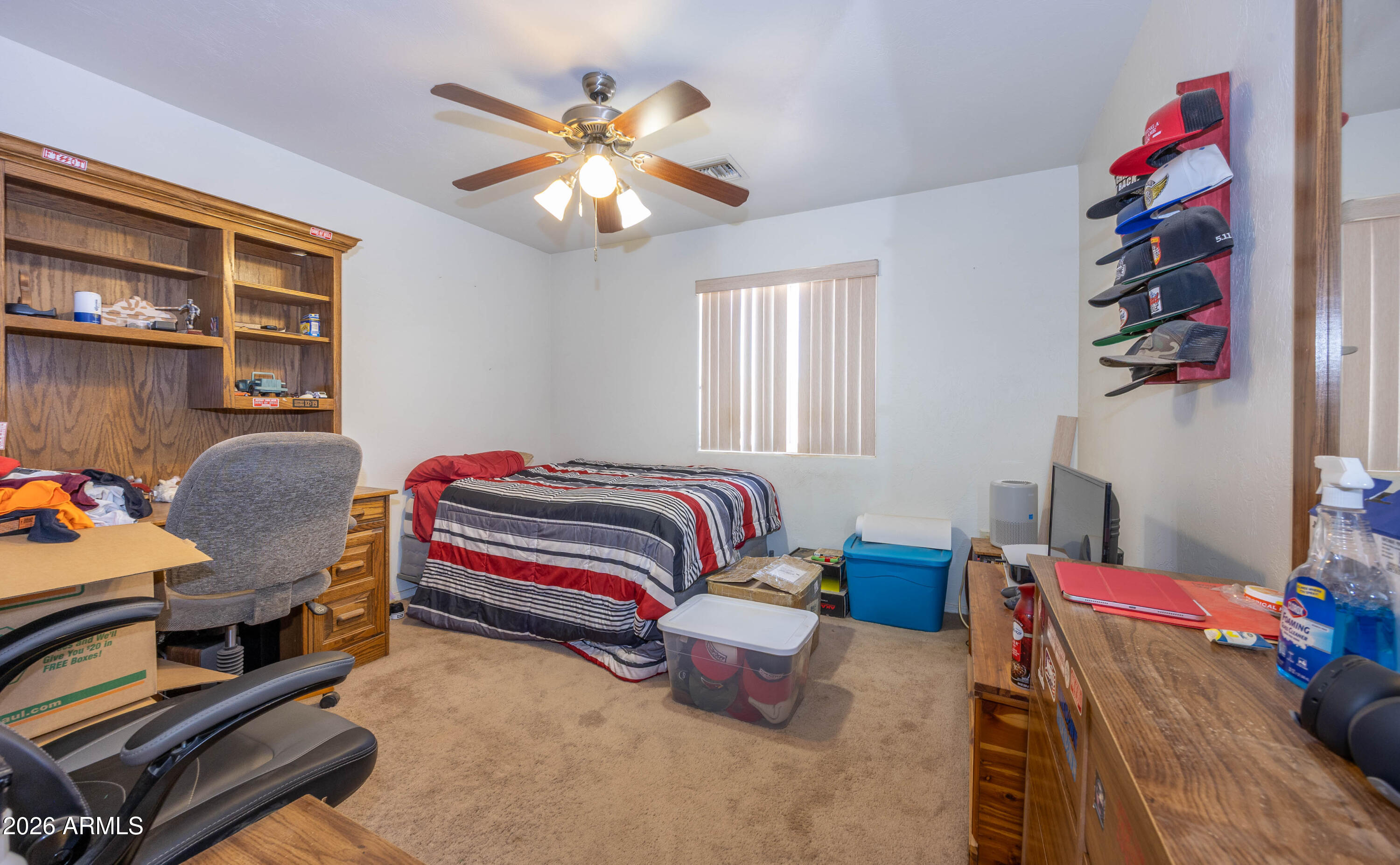 4575 South Kino Road Sierra Vista, AZ 85650 - Photo 23 of 25 a bedroom with furniture and a chandelier
