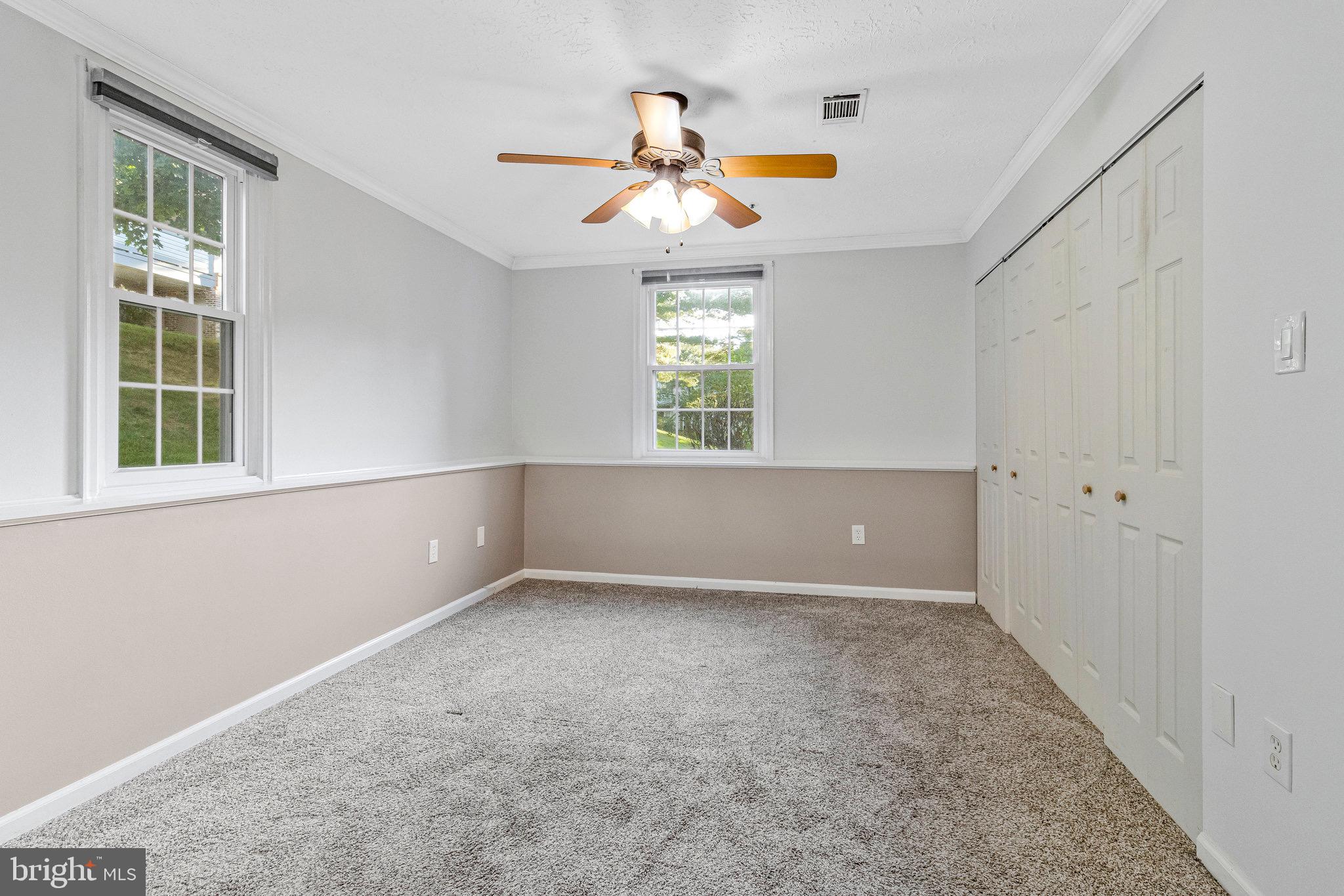 12212 Eagles Nest Court, Unit B Germantown, MD 20874 - Photo 13 of 36 a view of an empty room with a window
