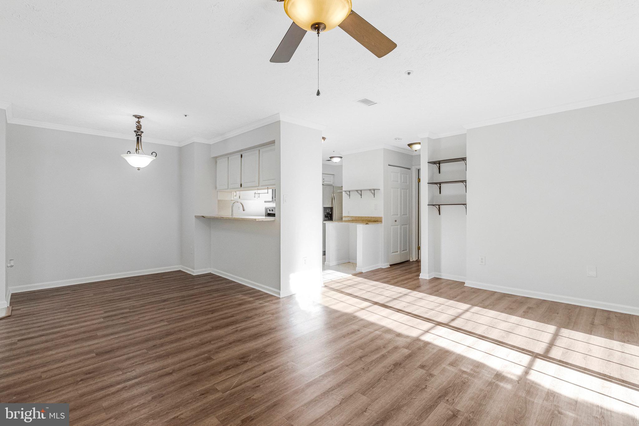 12212 Eagles Nest Court, Unit B Germantown, MD 20874 - Photo 17 of 36 a view of a kitchen with wooden floor and a kitchen space