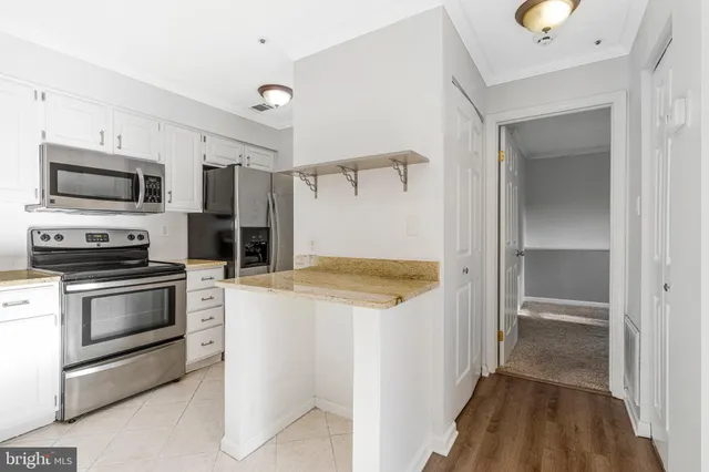 an empty room with closet area