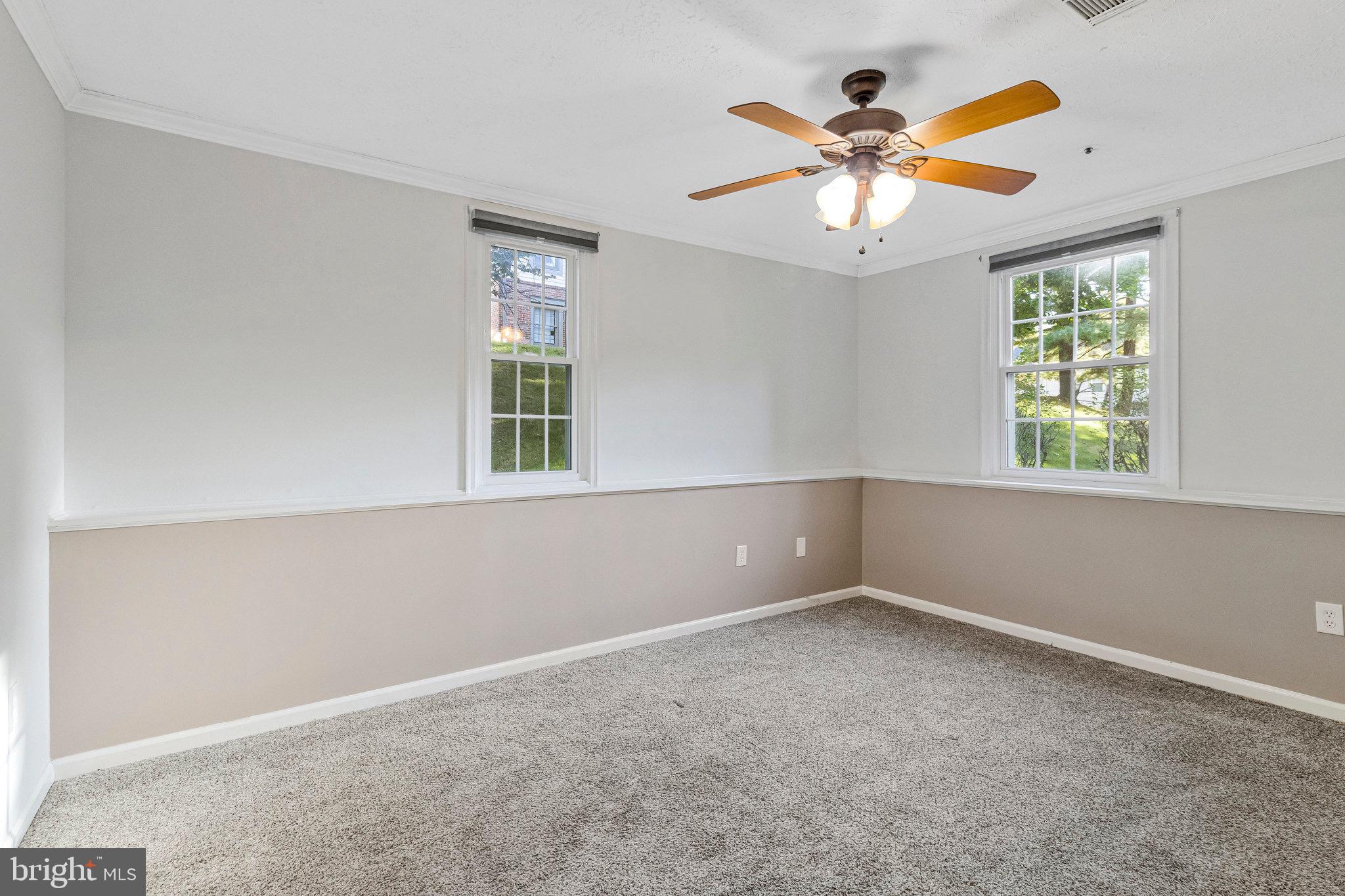 12212 Eagles Nest Court, Unit B Germantown, MD 20874 - Photo 2 of 36 an empty room with window and ceiling fan