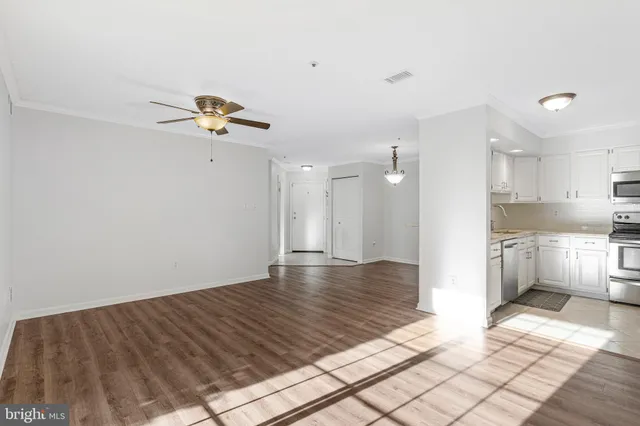 a view of a kitchen with microwave and stove