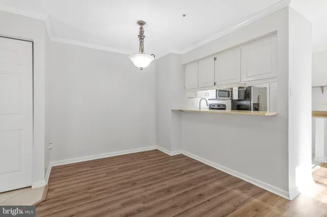 a bathroom with a toilet a sink a vanity and mirror