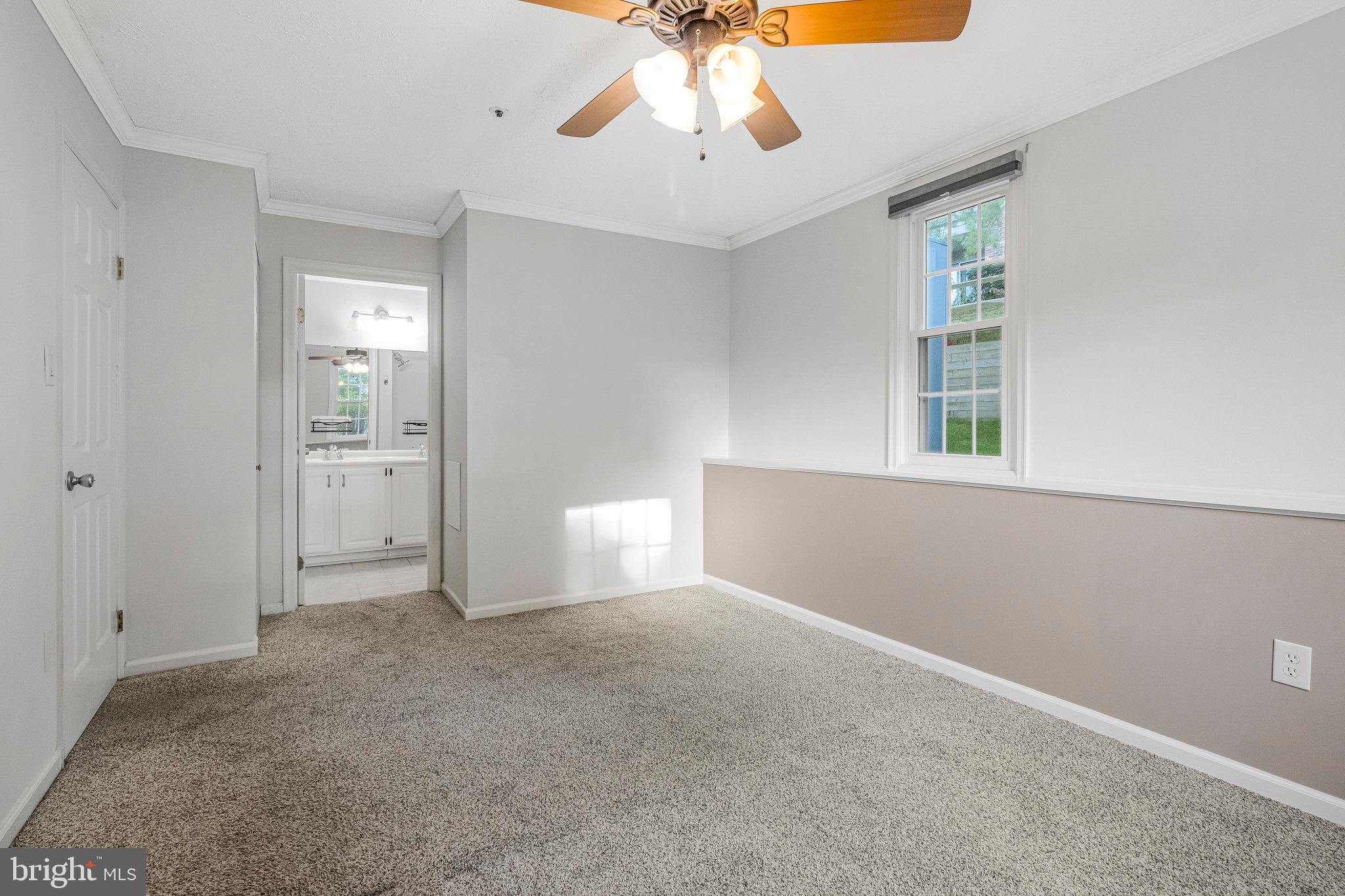 12212 Eagles Nest Court, Unit B Germantown, MD 20874 - Photo 6 of 36 wooden floor in an empty room with a window