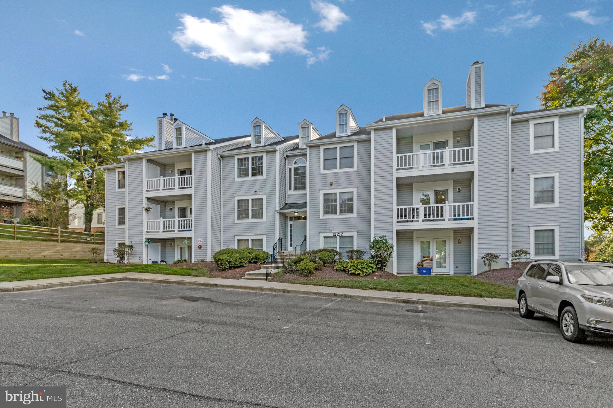 12212 Eagles Nest Court, Unit B Germantown, MD 20874 - Photo 7 of 36 a car parked in front of a brick building