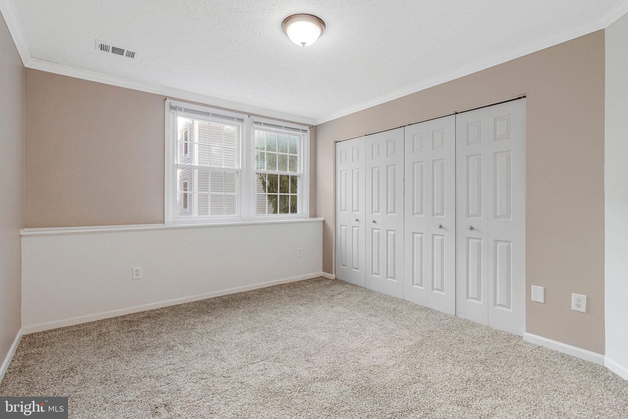 12212 Eagles Nest Court, Unit B Germantown, MD 20874 - Photo 9 of 36 an empty room with windows