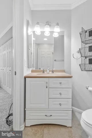 a front view of a residential apartment building with a yard