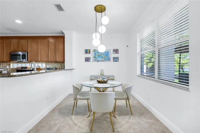 a dining room with furniture and window