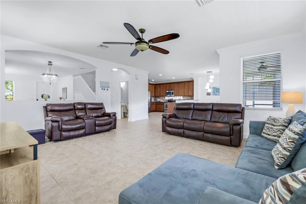 1570 Double Eagle Trail Naples, FL 34120 - Photo 20 of 50 a living room with furniture and kitchen view
