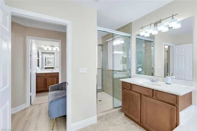 a bathroom with a sink vanity and a mirror