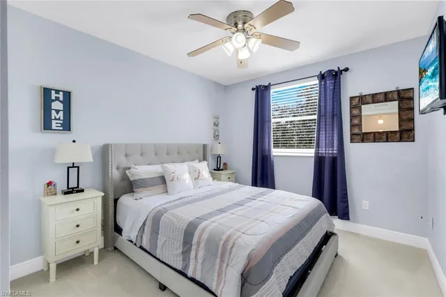 a bedroom with a bed dresser and a window