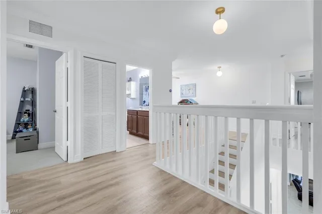 a view of a kitchen with wooden floor