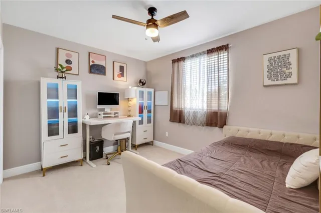 a bedroom with furniture and a fireplace