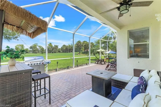 a view of a patio with a table and chairs