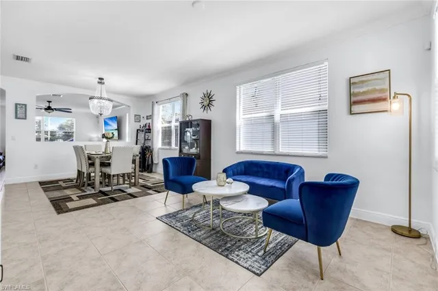 a living room with furniture and a window