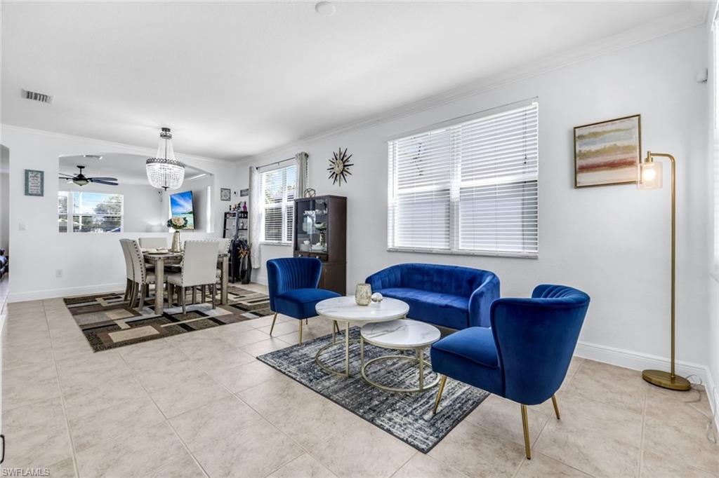 1570 Double Eagle Trail Naples, FL 34120 - Photo 4 of 50 a living room with furniture and a window