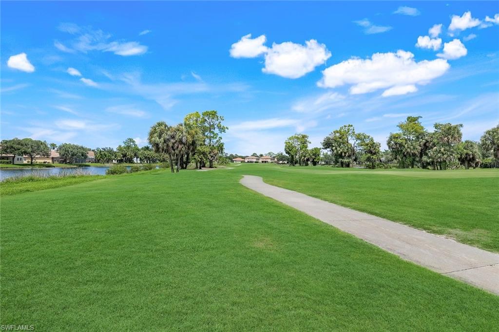 1570 Double Eagle Trail Naples, FL 34120 - Photo 41 of 50 a view of a golf course with a garden