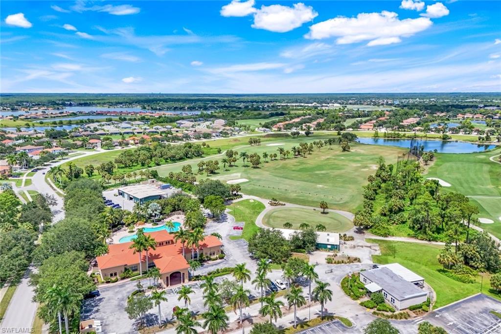 1570 Double Eagle Trail Naples, FL 34120 - Photo 46 of 50 an aerial view of residential houses with outdoor space and trees