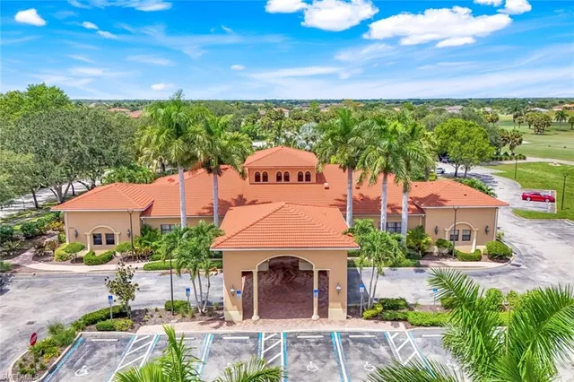a front view of a house with garden space and street view