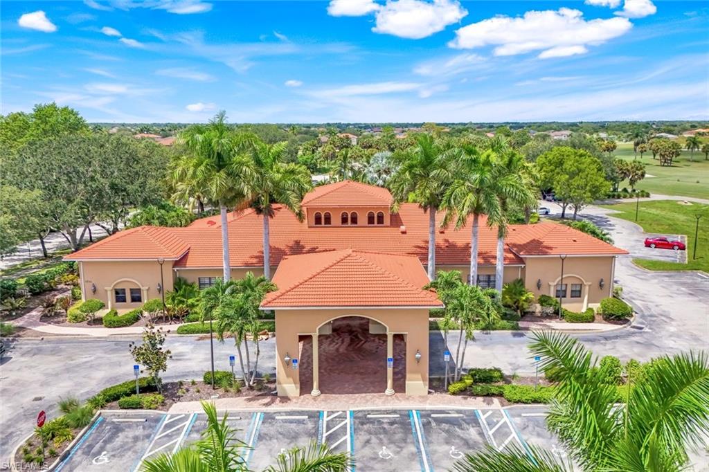 1570 Double Eagle Trail Naples, FL 34120 - Photo 47 of 50 a front view of a house with garden space and street view