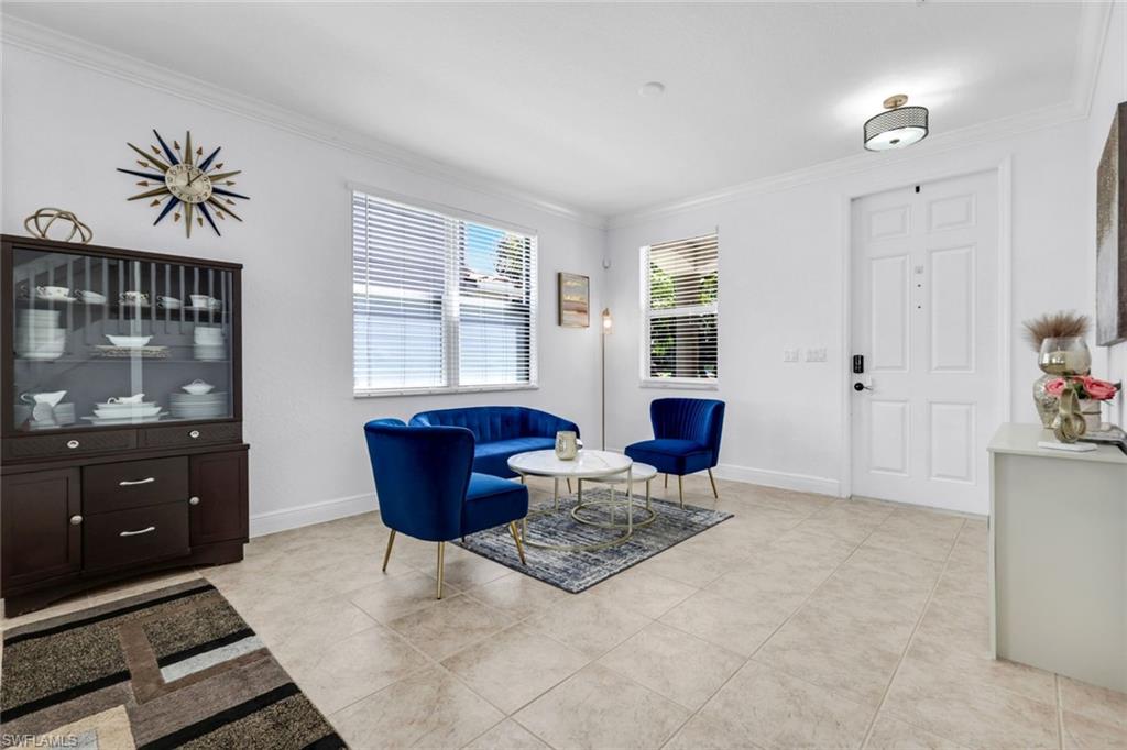 1570 Double Eagle Trail Naples, FL 34120 - Photo 6 of 50 a living room with furniture and a window