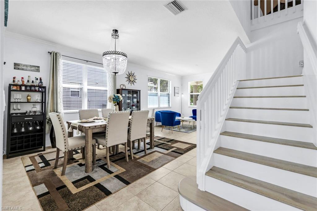 1570 Double Eagle Trail Naples, FL 34120 - Photo 7 of 50 a view of a dining room with furniture