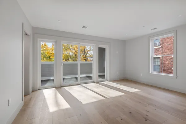 a view of an empty room with a window