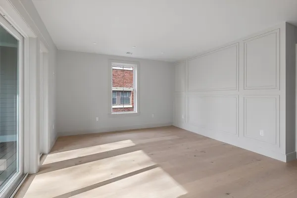 a view of an empty room with a window
