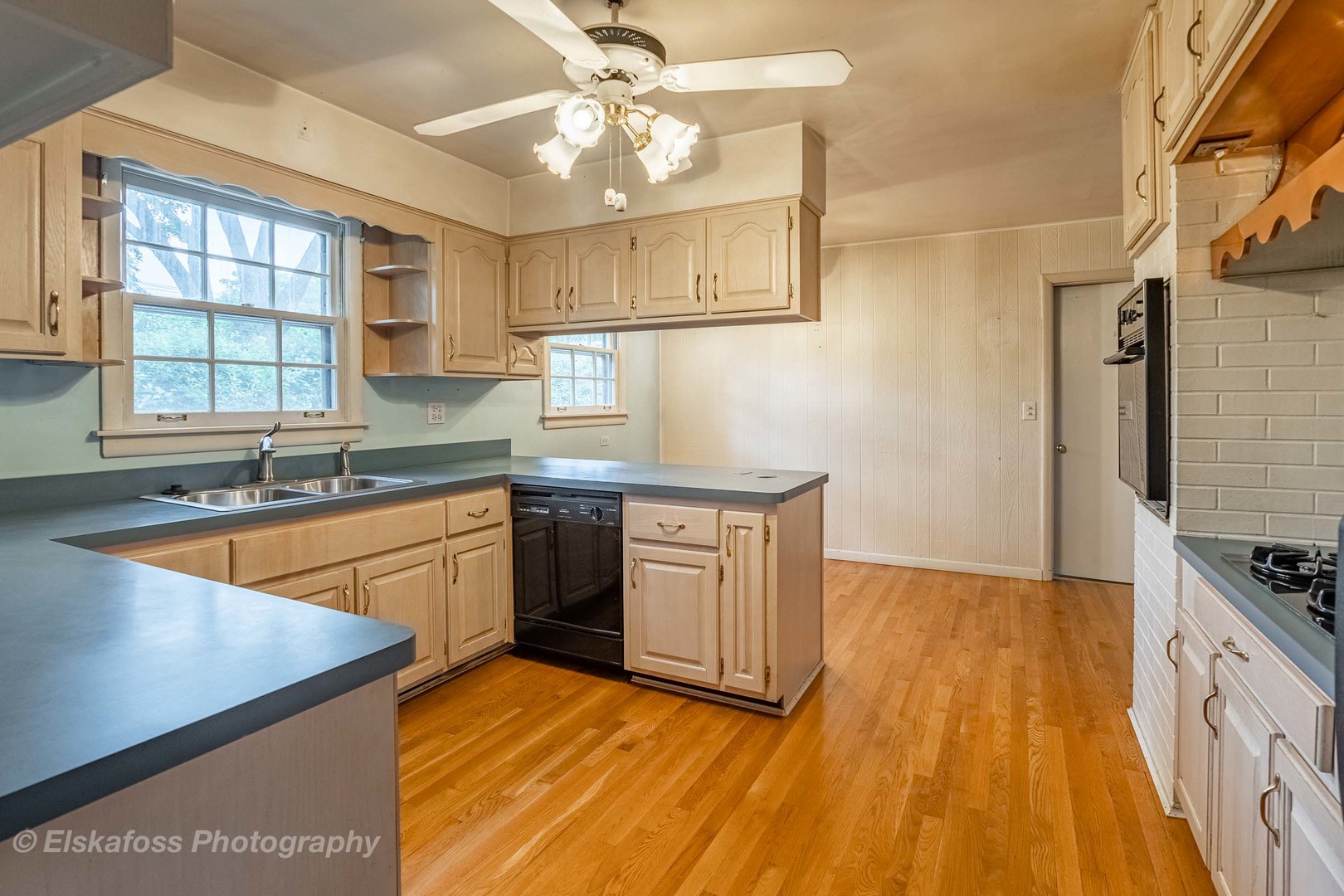 2114 Driving Park Road Wheaton, IL 60187 - Photo 5 of 14 a kitchen with stainless steel appliances granite countertop a sink stove and refrigerator
