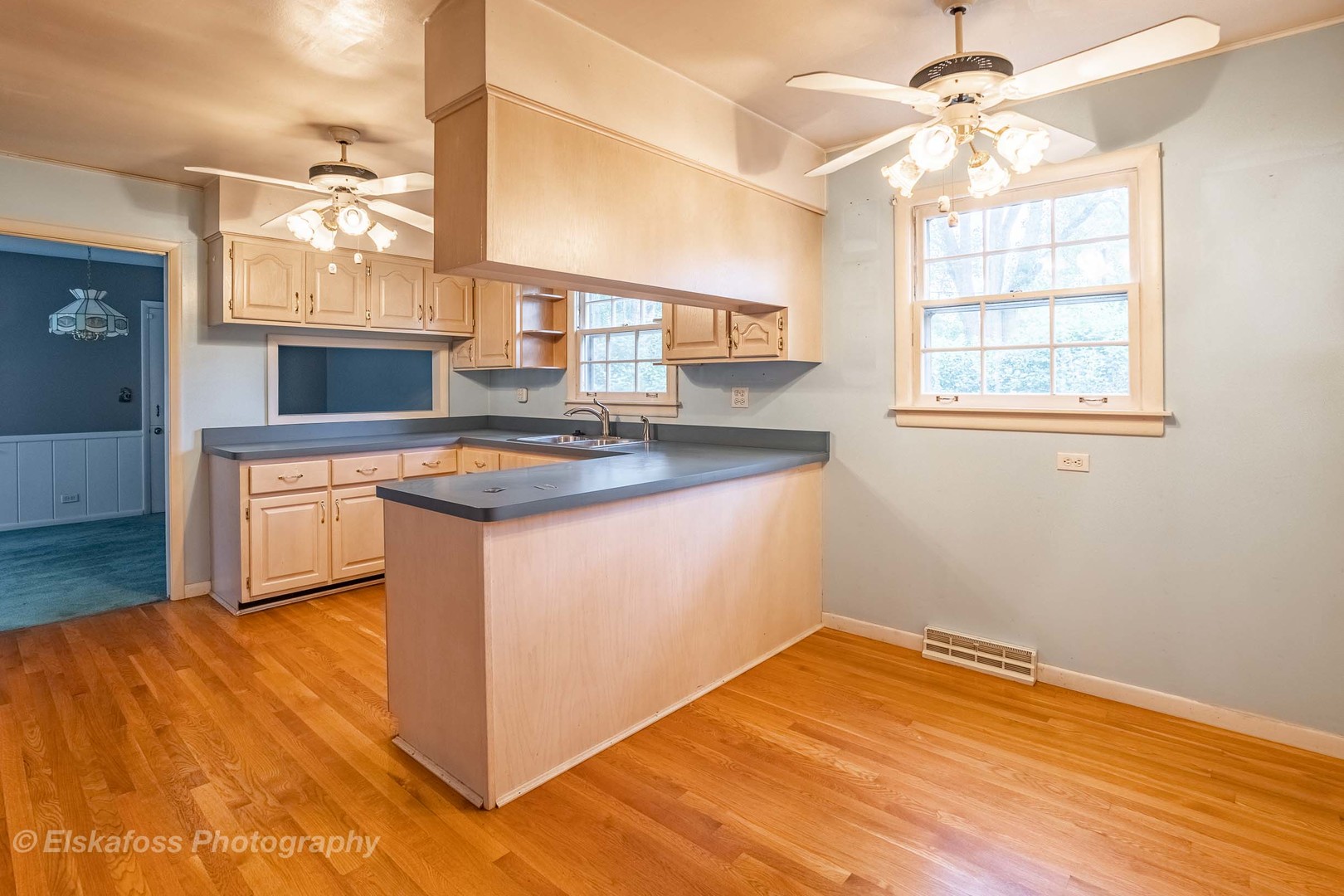 2114 Driving Park Road Wheaton, IL 60187 - Photo 6 of 14 a kitchen with stainless steel appliances granite countertop a sink dishwasher and a stove with wooden floor