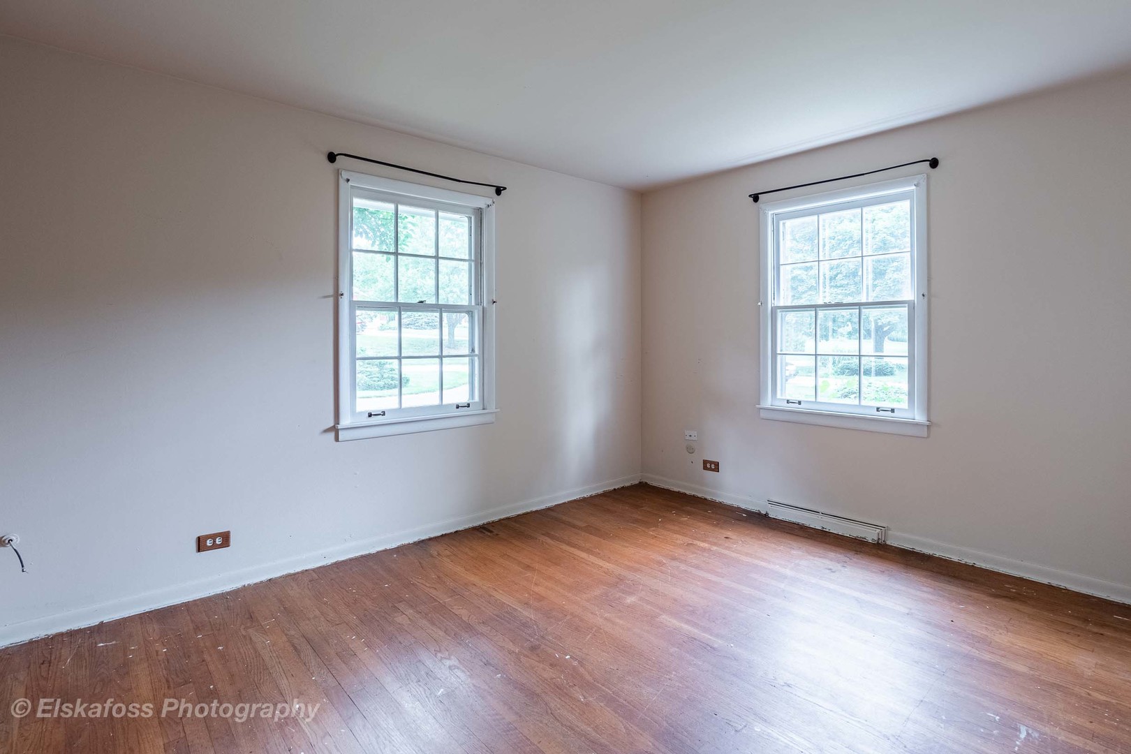 2114 Driving Park Road Wheaton, IL 60187 - Photo 10 of 14 a view of an empty room with wooden floor and a window