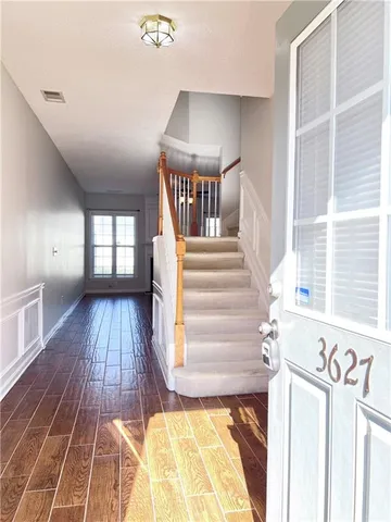 a view of entryway with wooden floor