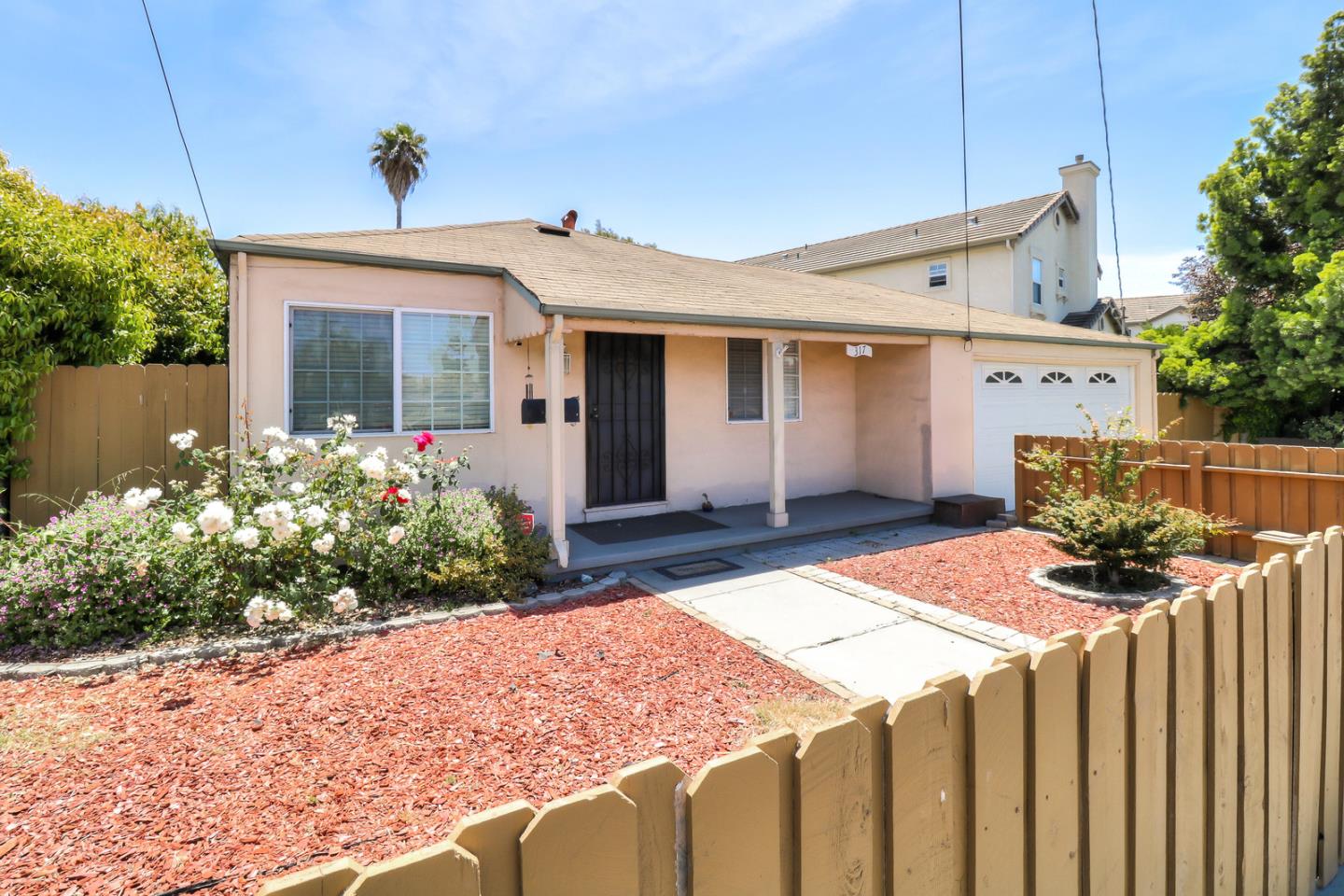 317 Tennyson Road Hayward, CA 94544 - Photo 1 of 21 a front view of house with yard