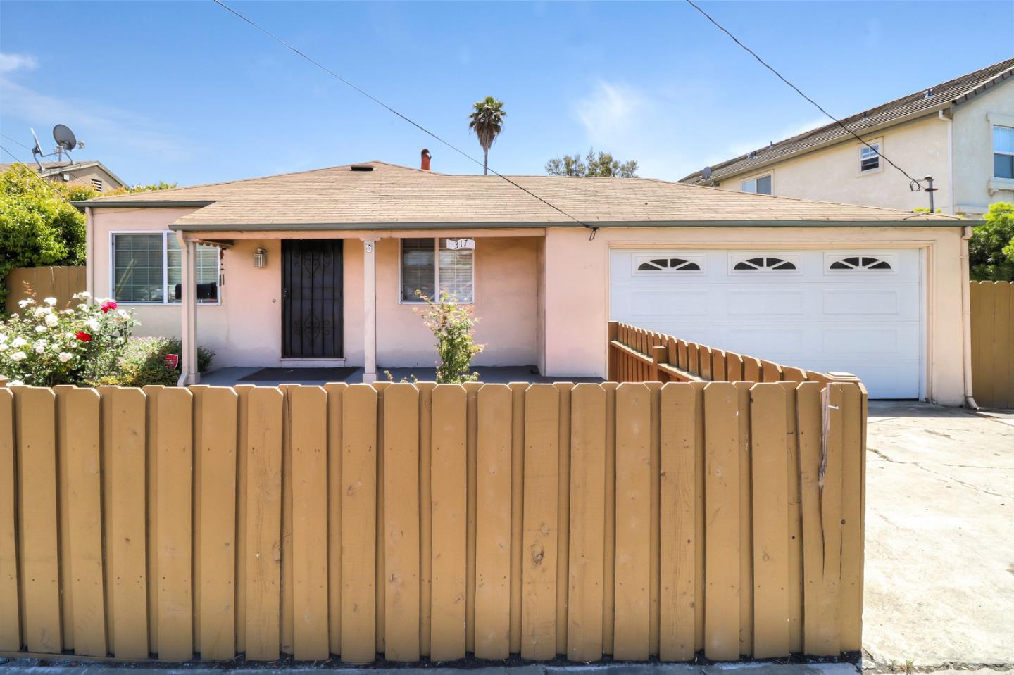 317 Tennyson Road Hayward, CA 94544 - Photo 2 of 21 a front view of a house with garden