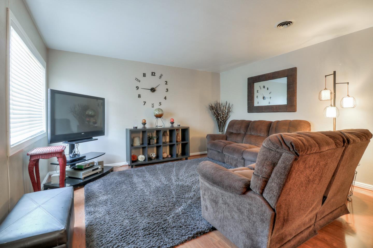 317 Tennyson Road Hayward, CA 94544 - Photo 3 of 21 a living room with furniture and a flat screen tv