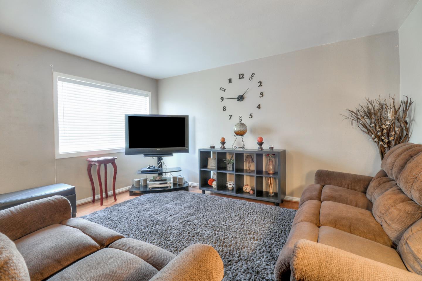 317 Tennyson Road Hayward, CA 94544 - Photo 4 of 21 a living room with furniture and a flat screen tv