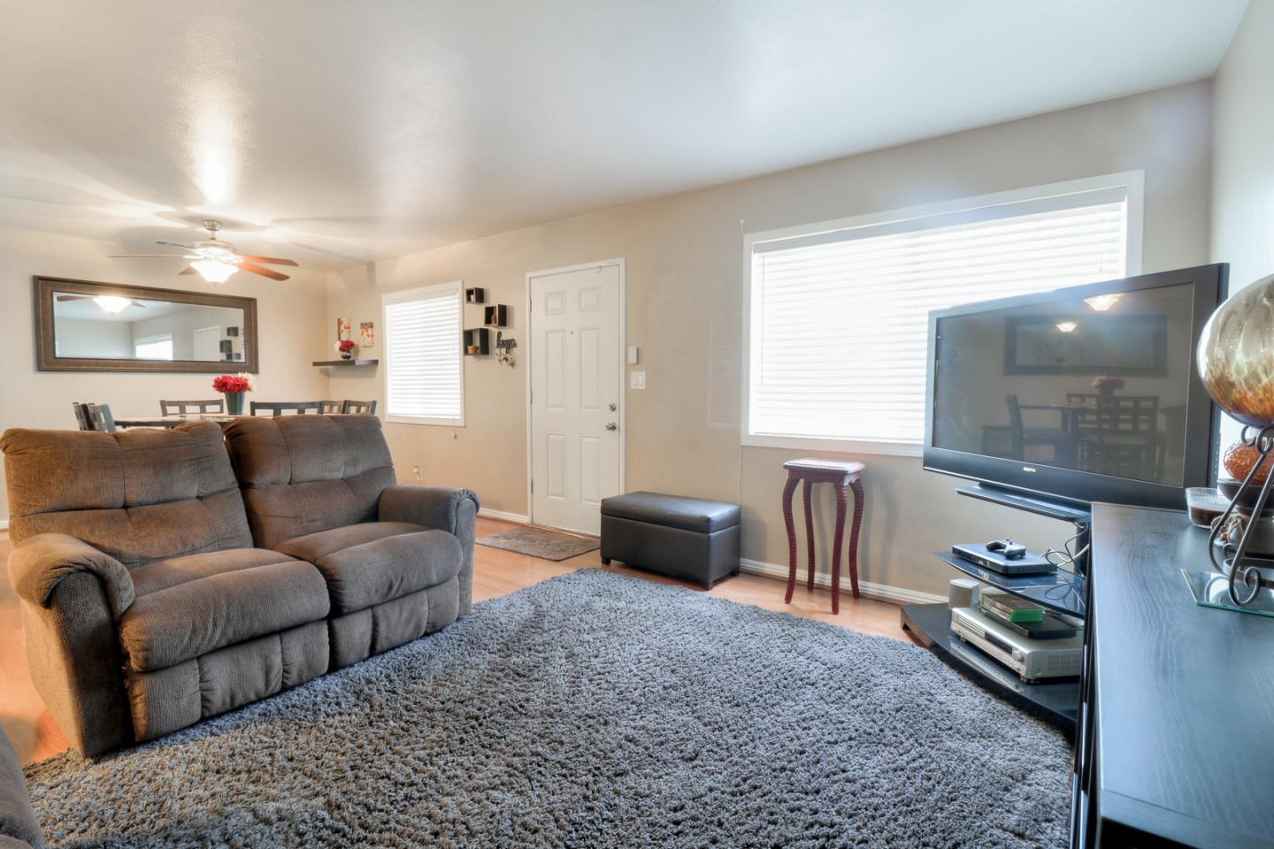 317 Tennyson Road Hayward, CA 94544 - Photo 5 of 21 a living room with furniture and a flat screen tv