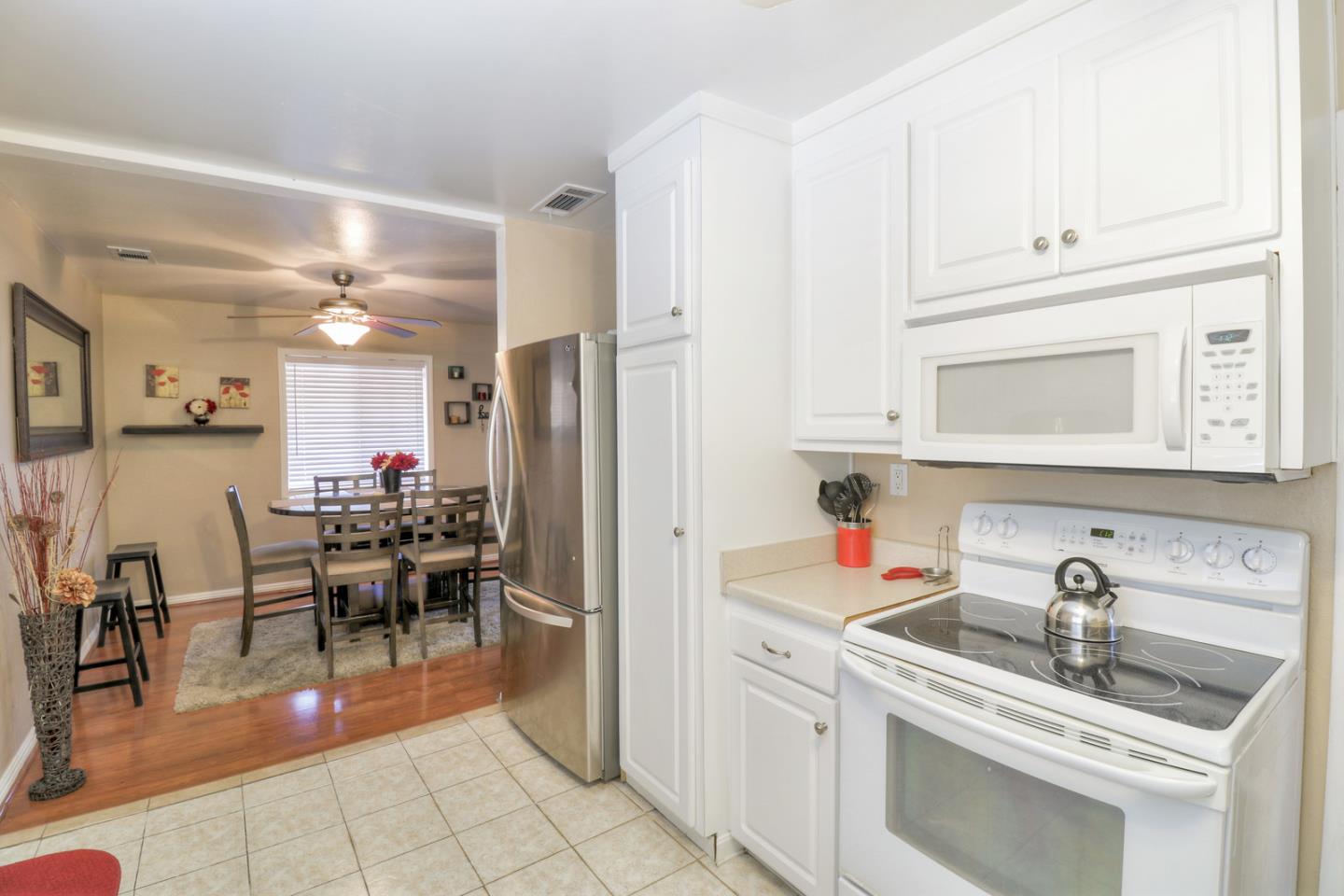 317 Tennyson Road Hayward, CA 94544 - Photo 9 of 21 a kitchen with stainless steel appliances granite countertop a sink and cabinets